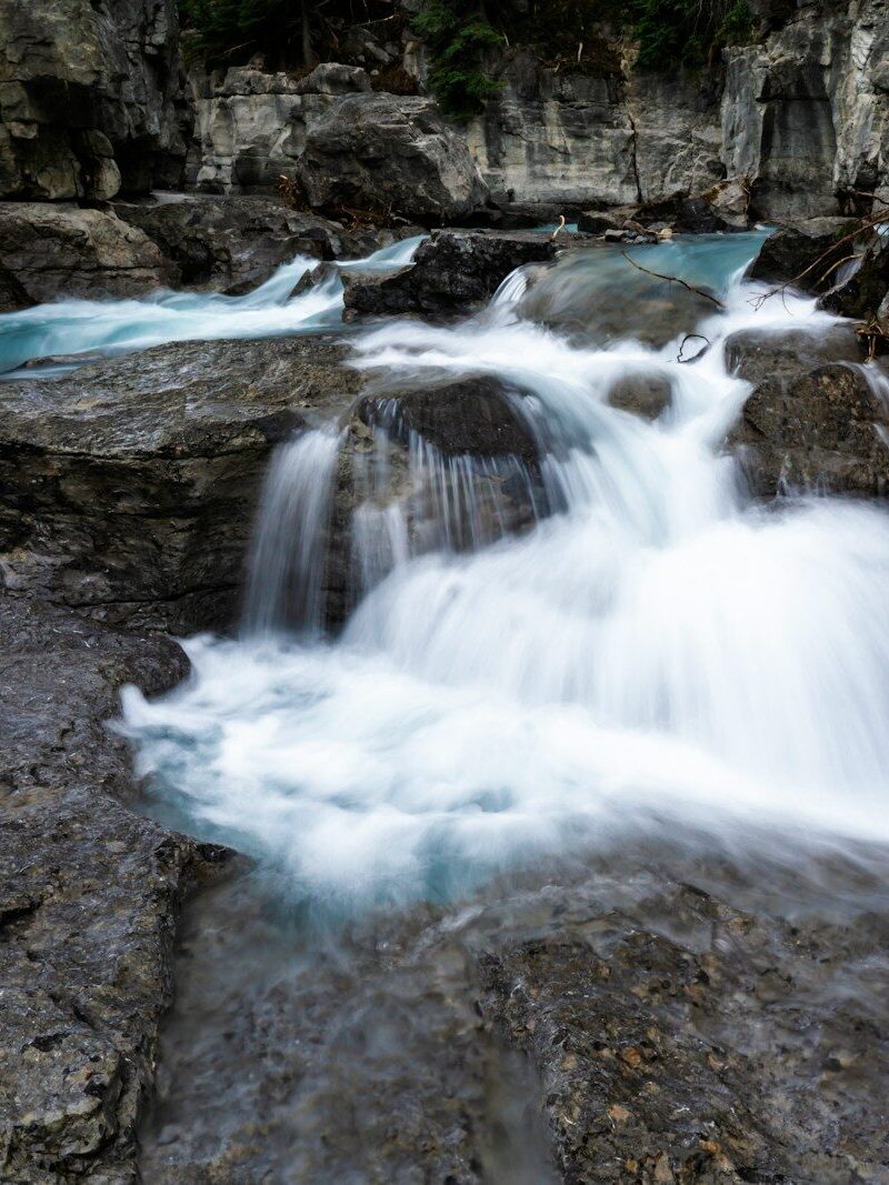 time lapse photography of water falls