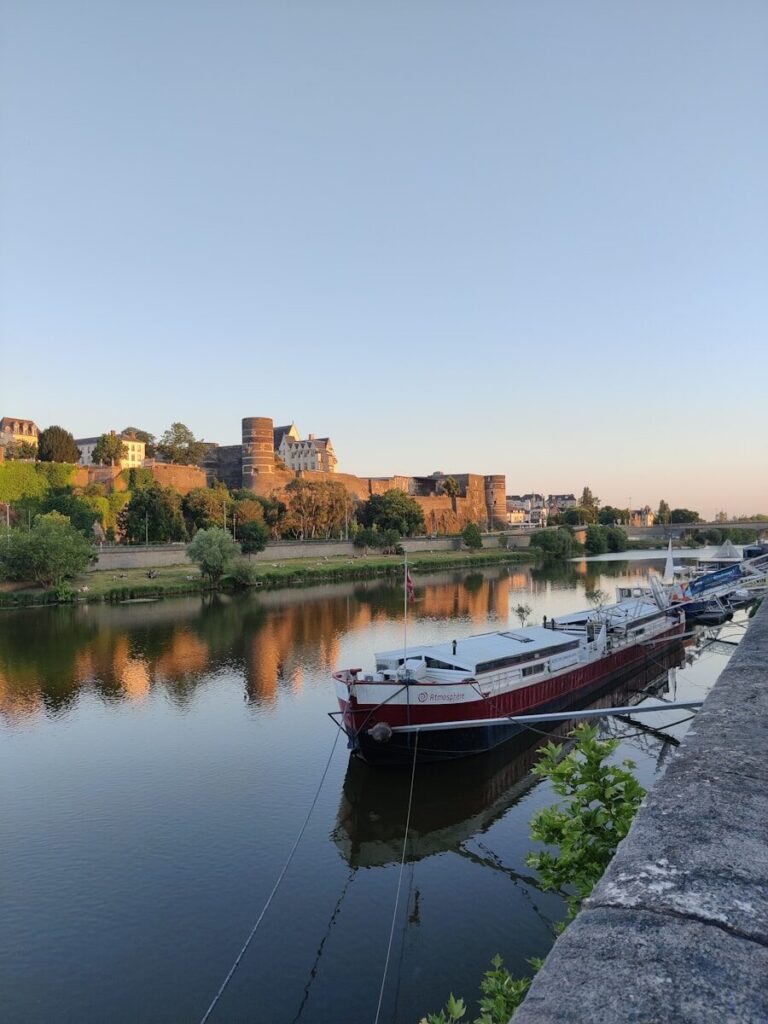a row of boats sitting on top of a river