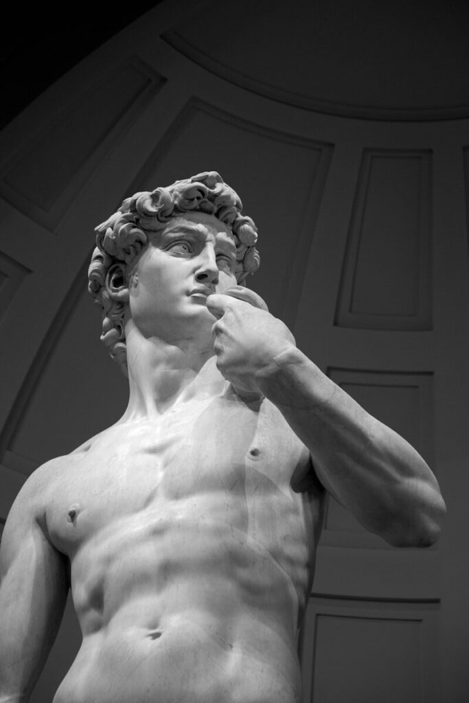 topless woman with white hair statue